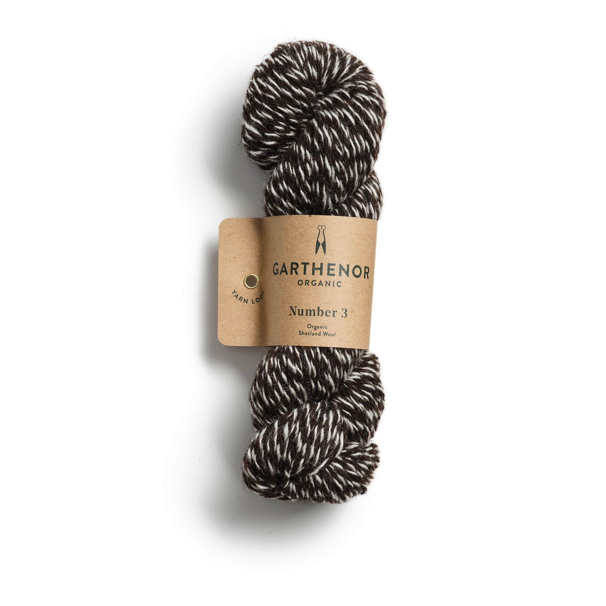 Garthenor Organic Number 3 (Previous Spin) DK yarn in Guillemot – a natural marl of dark brown and cream Shetland wool, photographed on a white background.